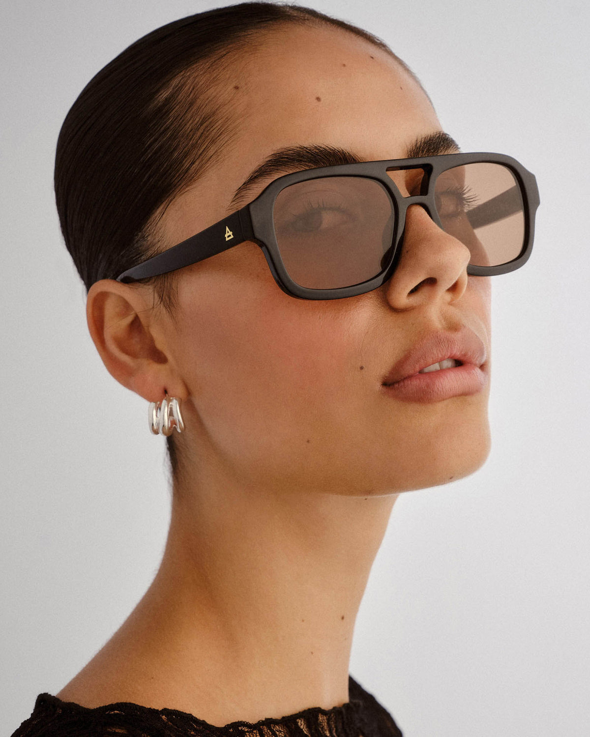 Aquarius Unisex Sunglasses Black Tan Tint Black